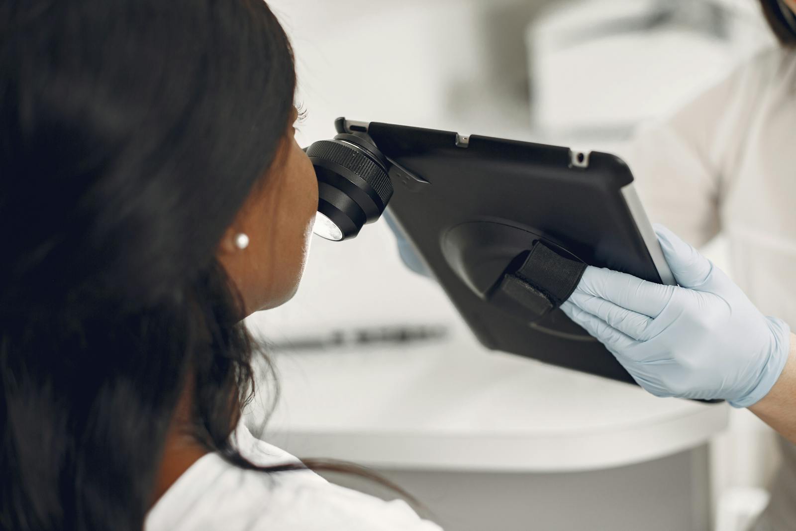 Nurse Vella performing a clinical skin assessment